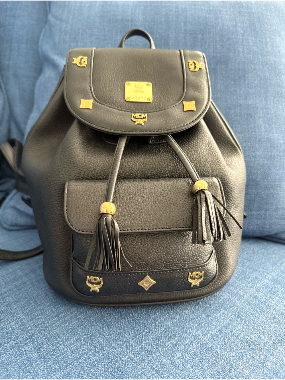 MCM Black Leather Drawstring Backpack with Gold Accents